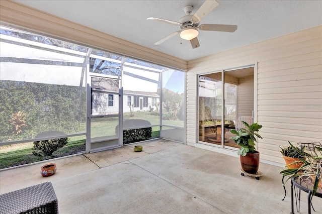 sunroom / solarium with ceiling fan