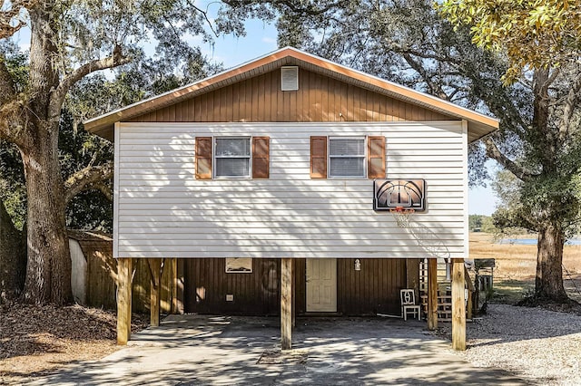 beach home featuring a carport and driveway