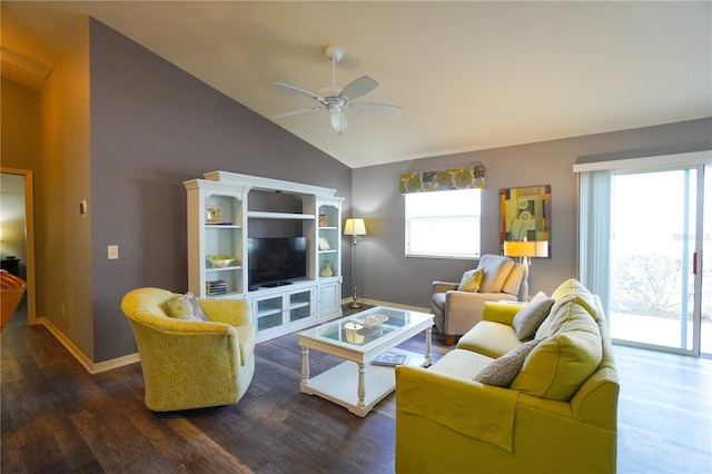 living room with ceiling fan, dark hardwood / wood-style flooring, and high vaulted ceiling