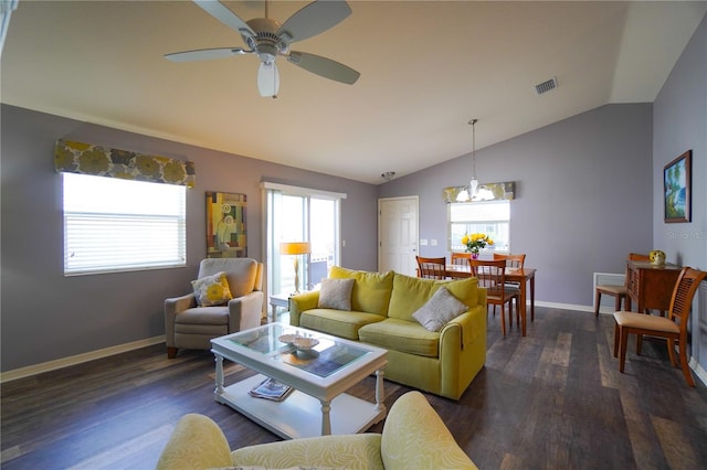 living room featuring ceiling fan, dark hardwood / wood-style flooring, and vaulted ceiling