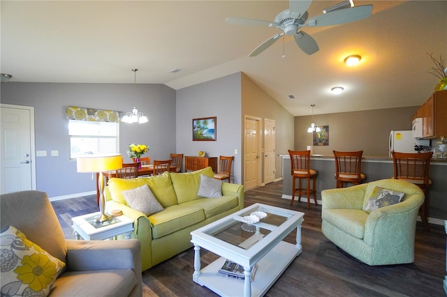 living room with lofted ceiling, ceiling fan with notable chandelier, and dark hardwood / wood-style floors