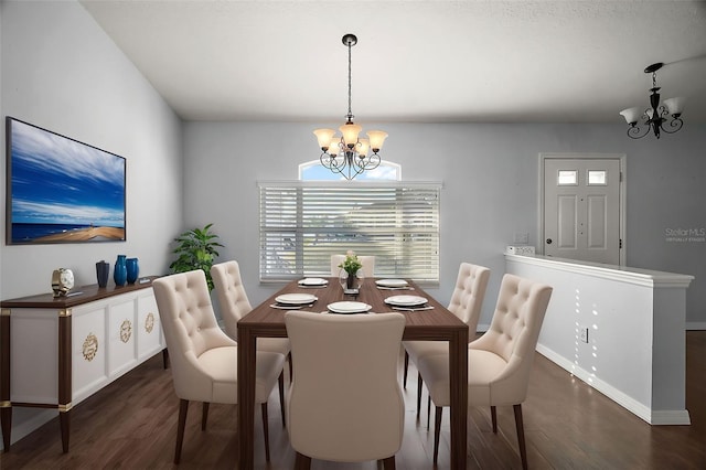 dining room featuring baseboards, wood finished floors, and a notable chandelier