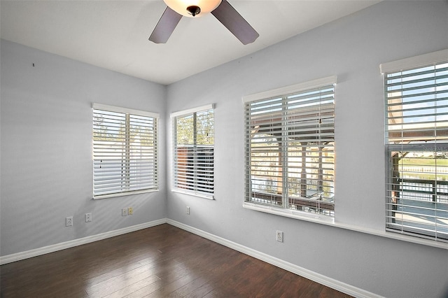 empty room with hardwood / wood-style flooring, baseboards, and a ceiling fan