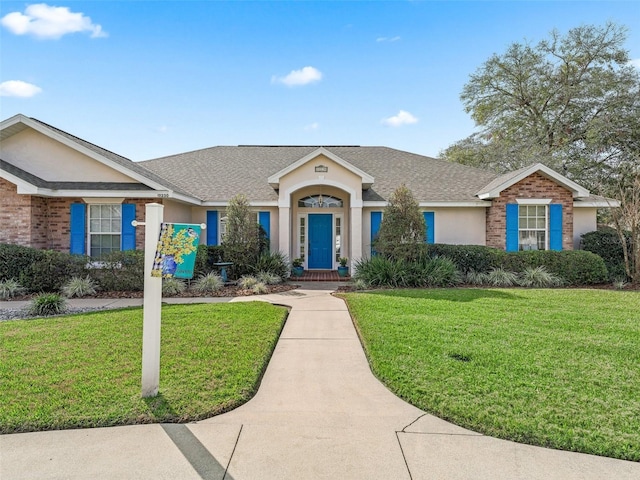 ranch-style house with a front lawn