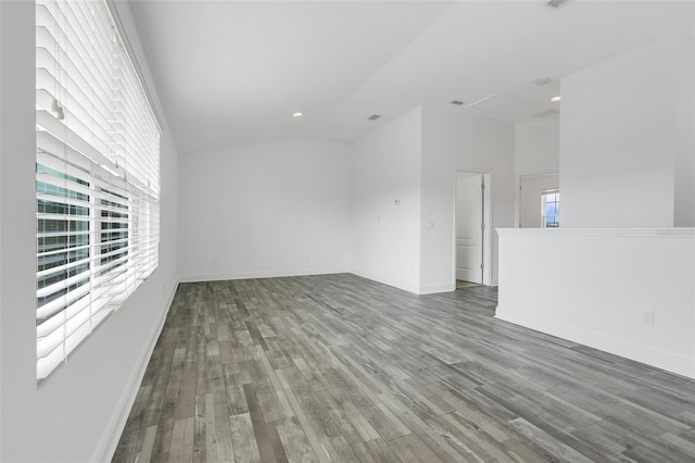 empty room featuring vaulted ceiling and hardwood / wood-style floors