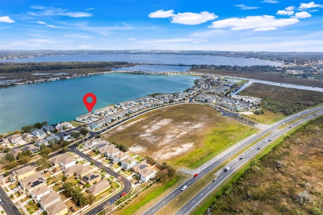 birds eye view of property featuring a water view