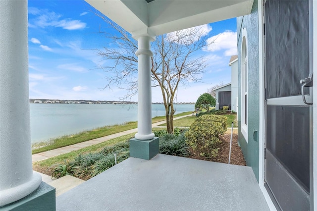 view of patio / terrace with a water view