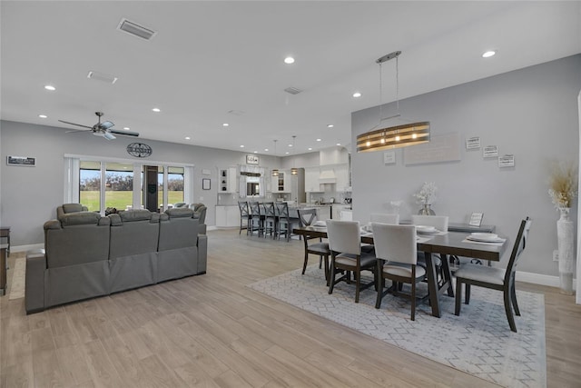 dining area with light hardwood / wood-style floors