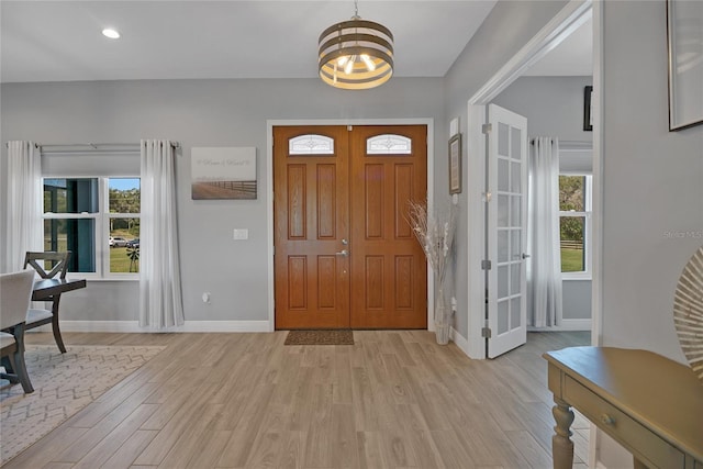 foyer with light hardwood / wood-style floors