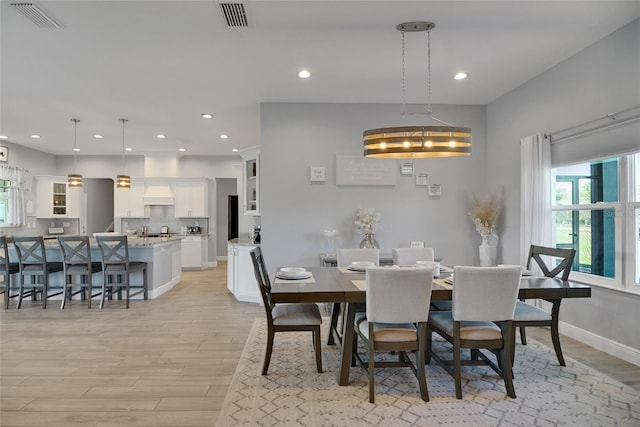 dining room with light hardwood / wood-style floors