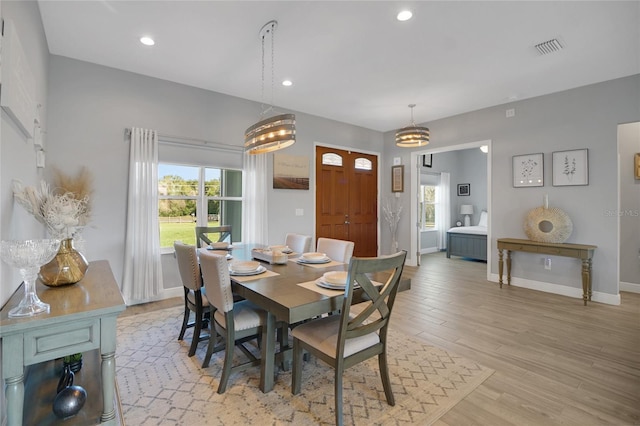 dining space featuring light hardwood / wood-style flooring