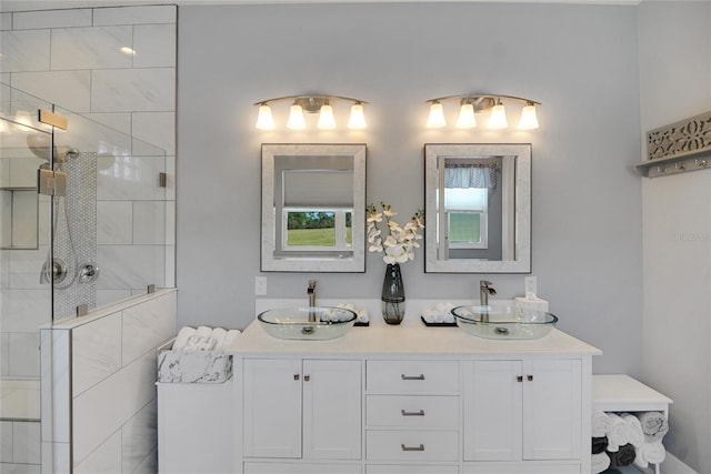 bathroom featuring vanity and a tile shower