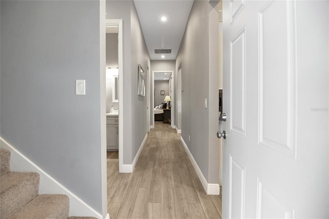 hallway with light wood-type flooring