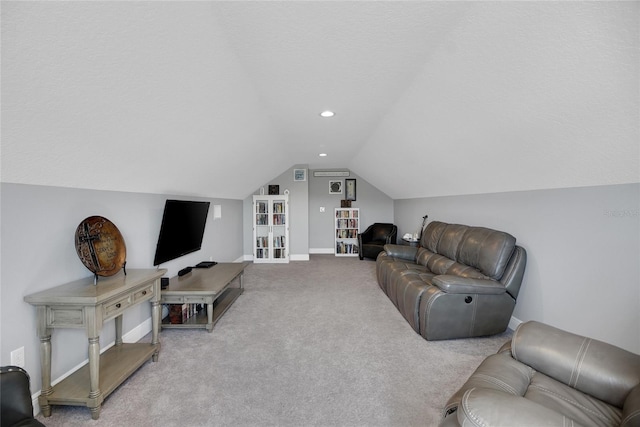 living room featuring lofted ceiling, light carpet, and a textured ceiling