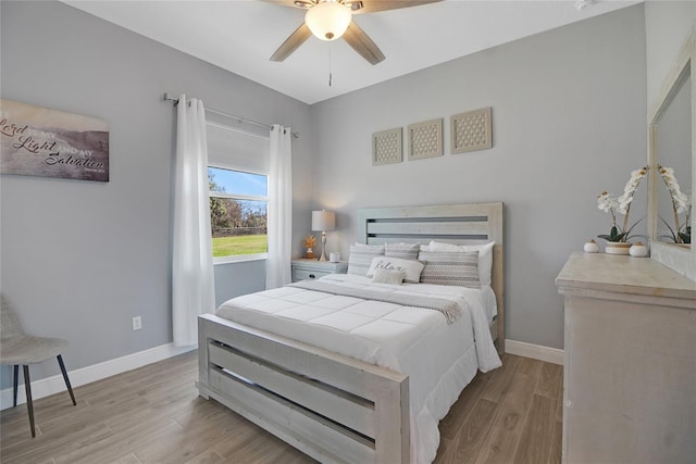 bedroom featuring ceiling fan and light wood-type flooring