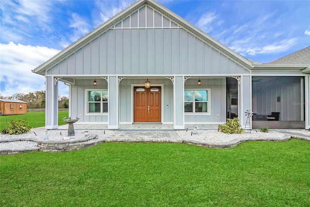 exterior space with a front lawn and covered porch