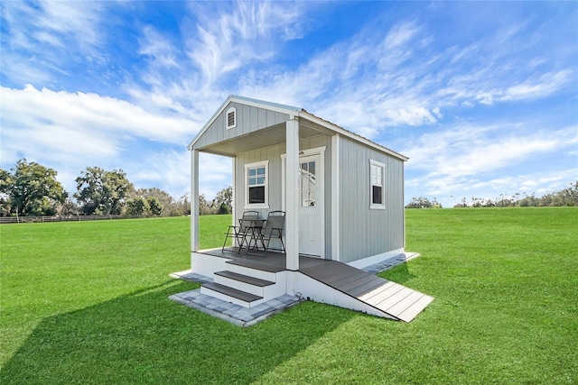 view of outdoor structure featuring a lawn