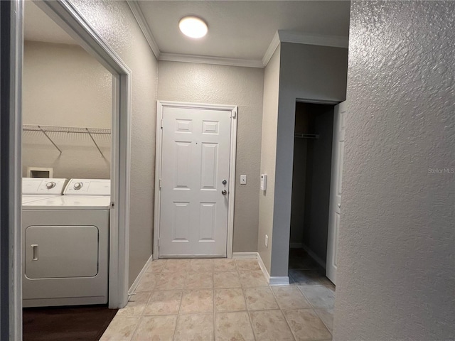 laundry room featuring light tile patterned floors, ornamental molding, and independent washer and dryer