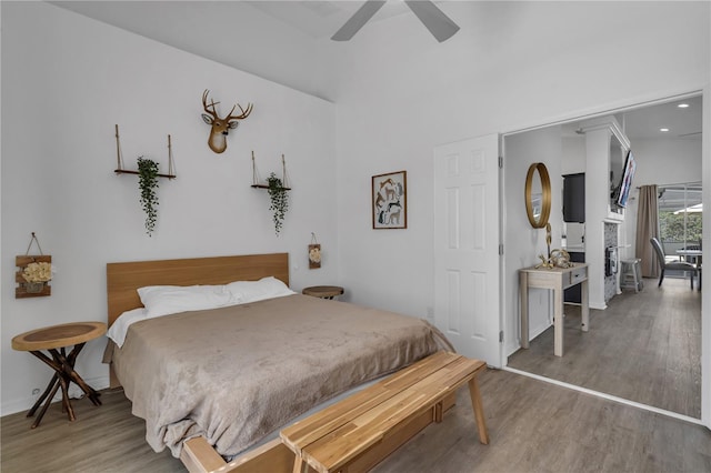 bedroom featuring hardwood / wood-style floors and ceiling fan