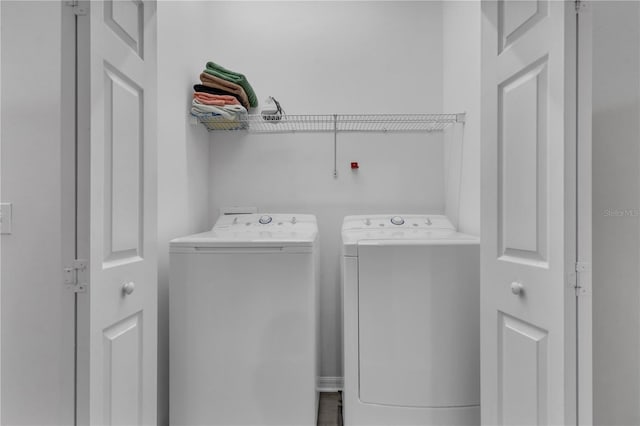 washroom featuring washer and clothes dryer