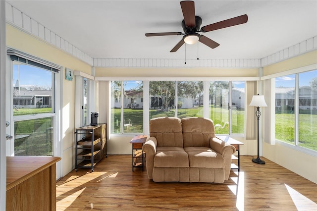 sunroom with ceiling fan and a healthy amount of sunlight