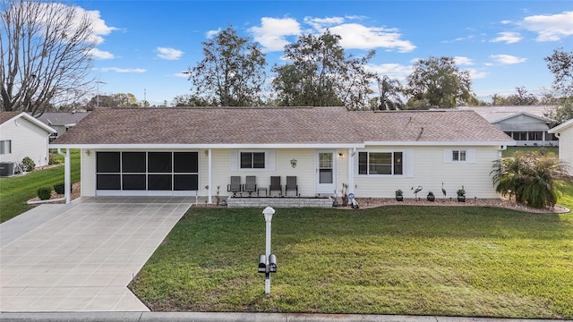 ranch-style house with covered porch, a front lawn, and central AC unit