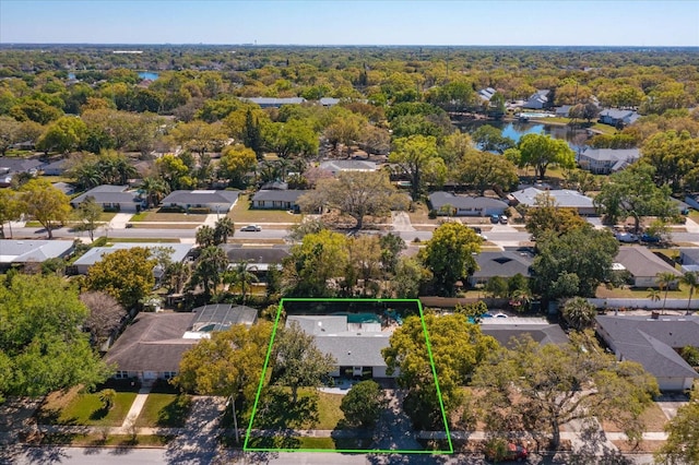 birds eye view of property with a forest view and a residential view