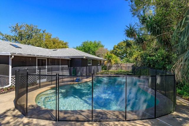 view of pool featuring a fenced in pool, a sunroom, and fence