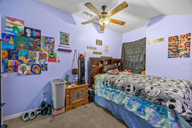 bedroom with vaulted ceiling, carpet floors, and a textured ceiling