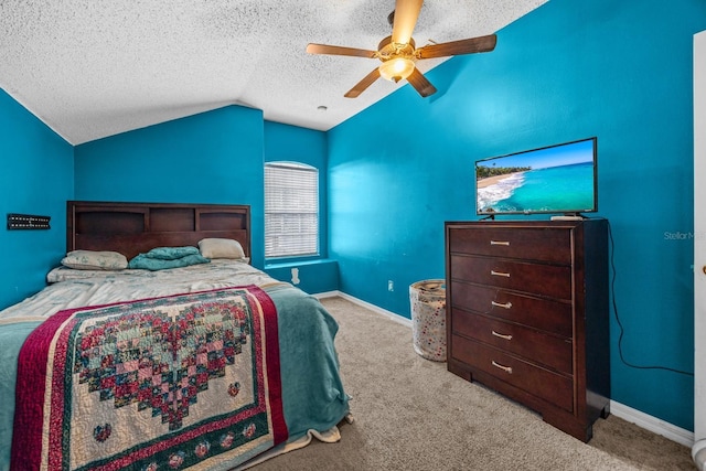 carpeted bedroom featuring lofted ceiling, ceiling fan, and a textured ceiling