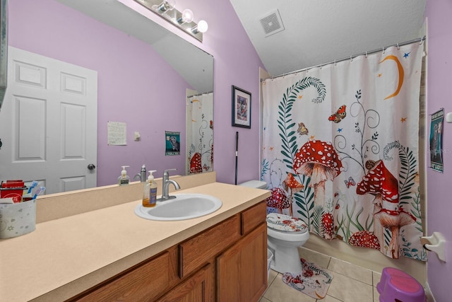 bathroom featuring toilet, tile patterned flooring, and vanity