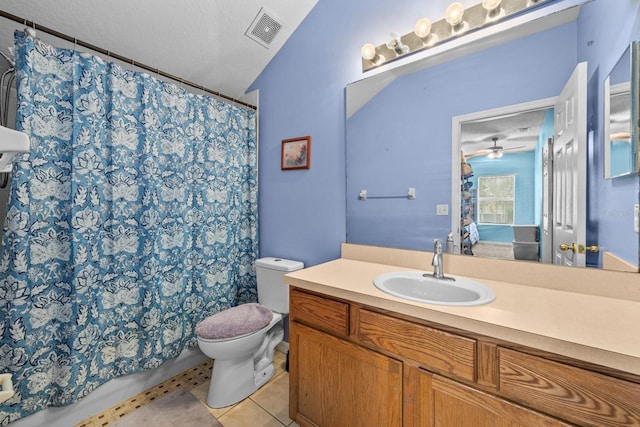 bathroom with vanity, tile patterned flooring, toilet, and a textured ceiling