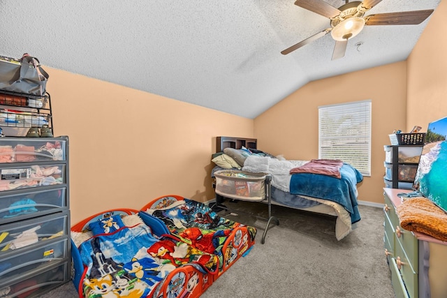 carpeted bedroom featuring ceiling fan, a textured ceiling, and lofted ceiling