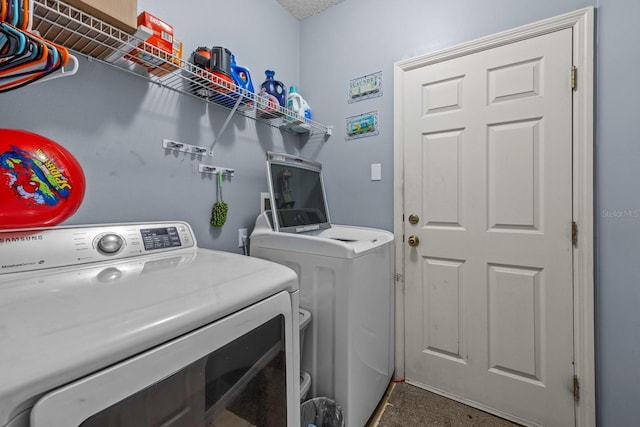 laundry room featuring separate washer and dryer