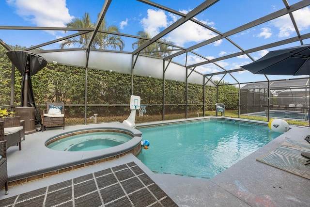 view of swimming pool with a patio, an in ground hot tub, and a lanai