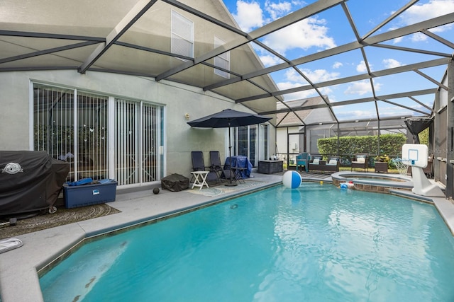 view of pool with an in ground hot tub, area for grilling, a lanai, and a patio area