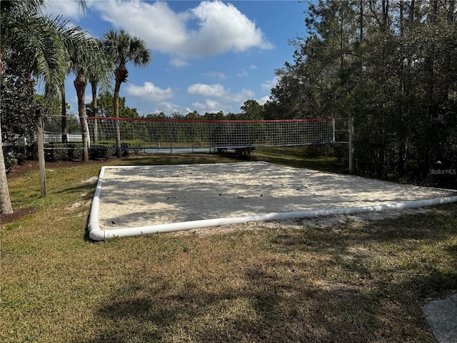 surrounding community featuring a yard and volleyball court