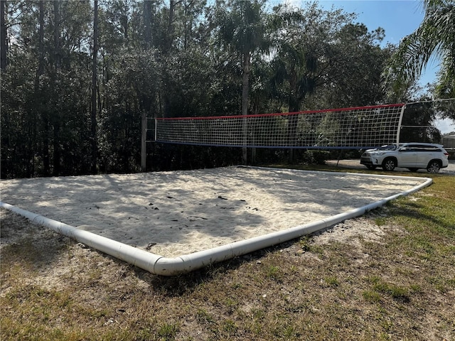 surrounding community featuring volleyball court