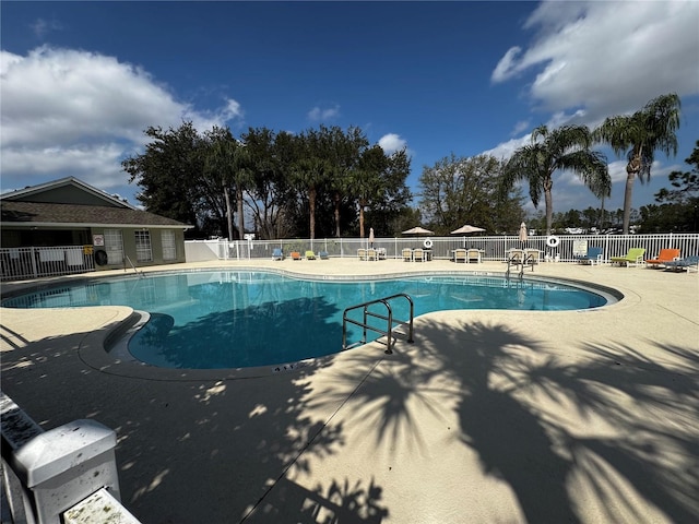 view of swimming pool featuring a patio area