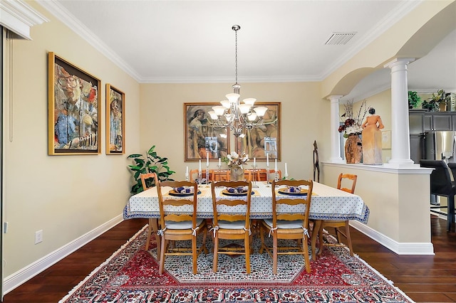 dining area featuring a chandelier, visible vents, baseboards, dark wood finished floors, and ornate columns