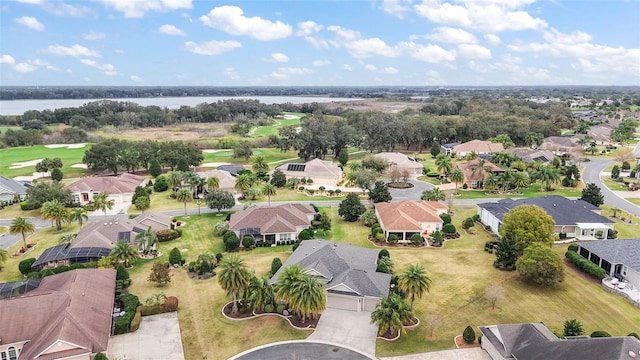 drone / aerial view featuring a water view and a residential view