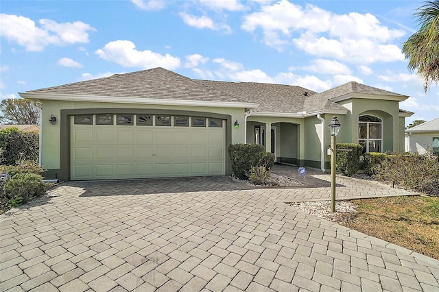 ranch-style house featuring a garage