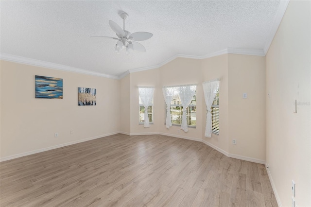 unfurnished room featuring ceiling fan, ornamental molding, a textured ceiling, and light wood-type flooring