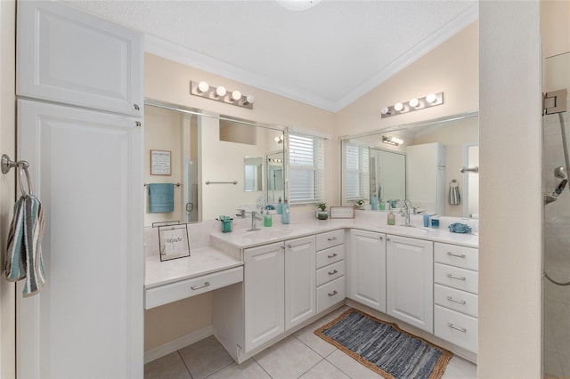 bathroom with a shower, lofted ceiling, tile patterned flooring, ornamental molding, and vanity