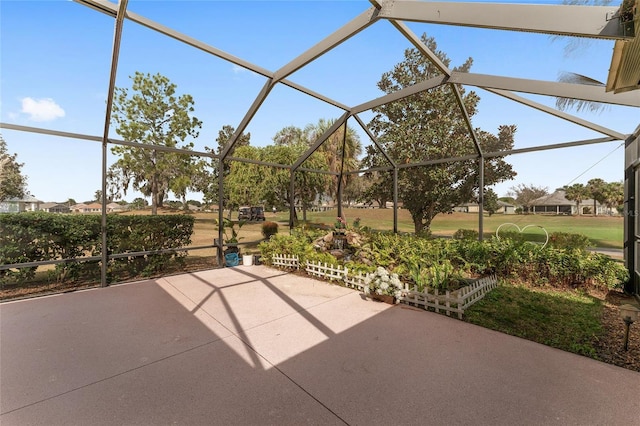 view of patio / terrace featuring glass enclosure