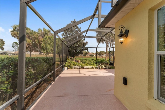 view of patio / terrace featuring a lanai