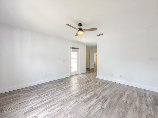 spare room with ceiling fan and light hardwood / wood-style floors