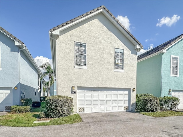 view of side of home with a garage