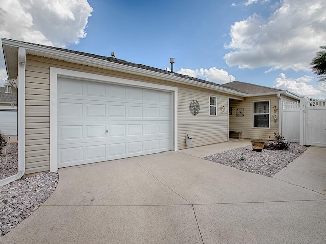 ranch-style home with driveway and an attached garage