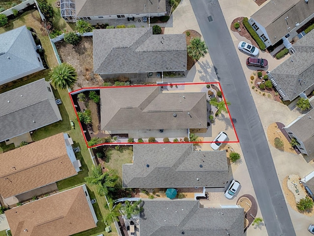 birds eye view of property with a residential view